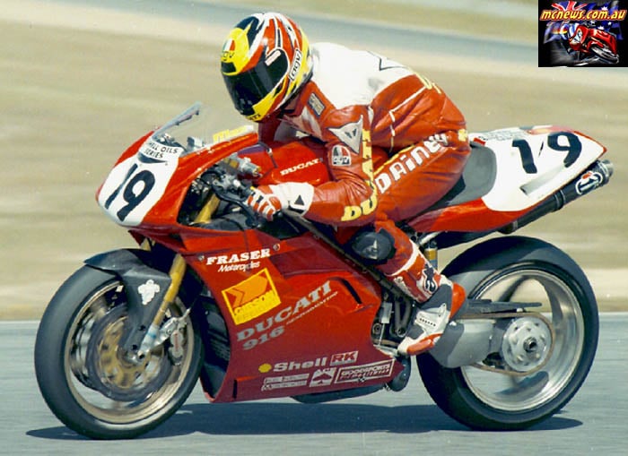 Shawn Giles racing a red number-19 Fraser Motorcycles Ducati superbike.