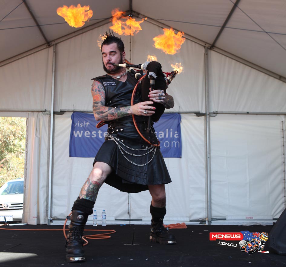 The Badpiper performing live on stage, complete with his leather kilt and flaming bagpipes