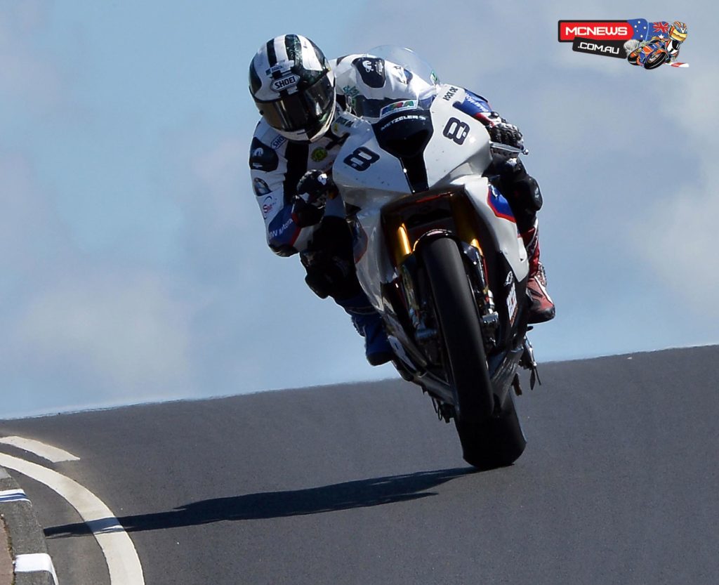 Michael Dunlop stormed to Superbike pole position on the Motorrad/Hawk BMW in blistering sunshine during the final qualifying session of the Vauxhall International North West 200 overnight.