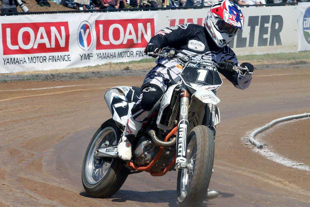 Troy Corser takes the bars of Troy Bayliss' bike