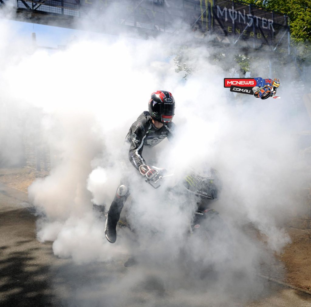 Ian Hutchinson disappears in a cloud of tyre smoke as his celebrates win number three - Monster Energy Supersport Race 2. Credit Stephen Davison/Pacemaker Press Intl.