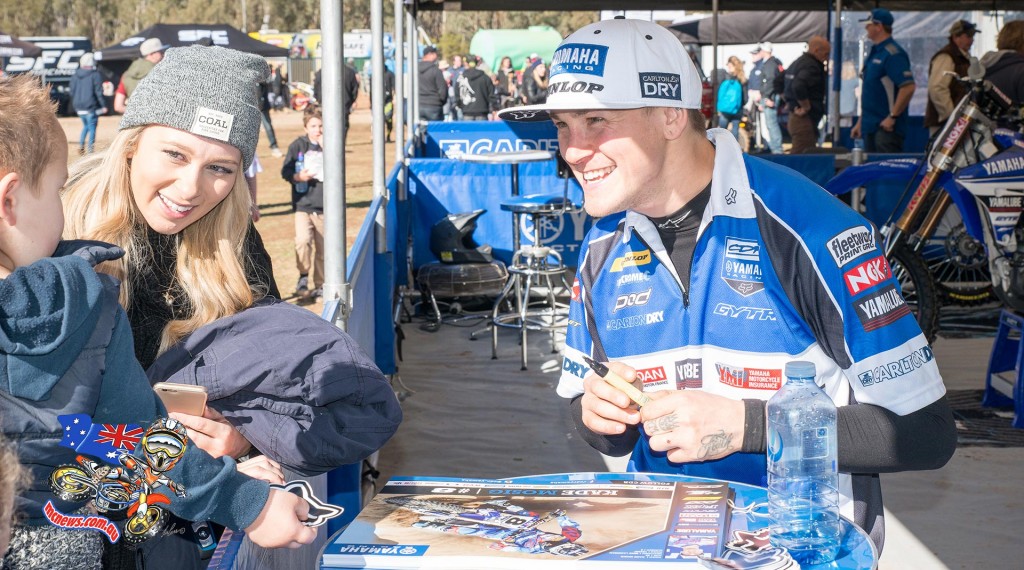 Kade Mosig delights a young fan in the pits between motos