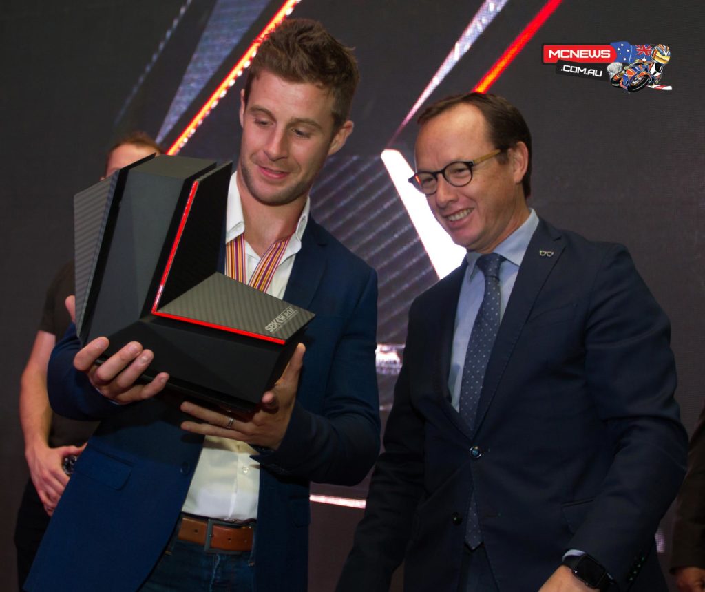 Jonathan Rea receives the 2015 WorldSBK title from WSBK Executive Director Javier Alonso