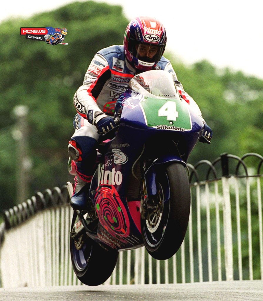 John McGuinness at Ballaugh Bridge on his way to winning the 250cc race