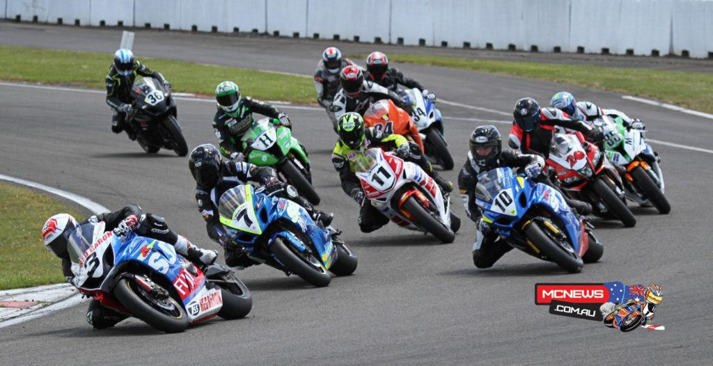 Sloan Frost leads the pack into the first corner in the opening F1 Superbike race
