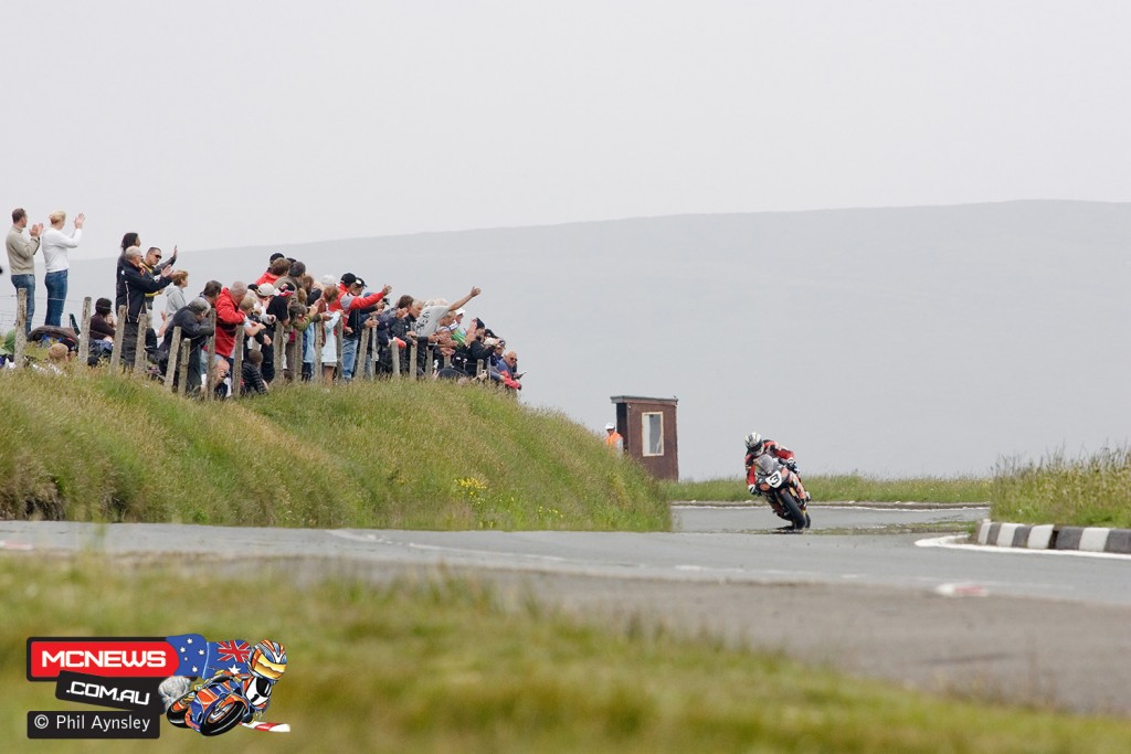 John McGuinness - Honda Fireblade receives cheers from the spectators on the Mountain on the lap following setting the first over 130mph lap average. 2007 Isle of Man Centenary Meeting by Phil Aynsley
