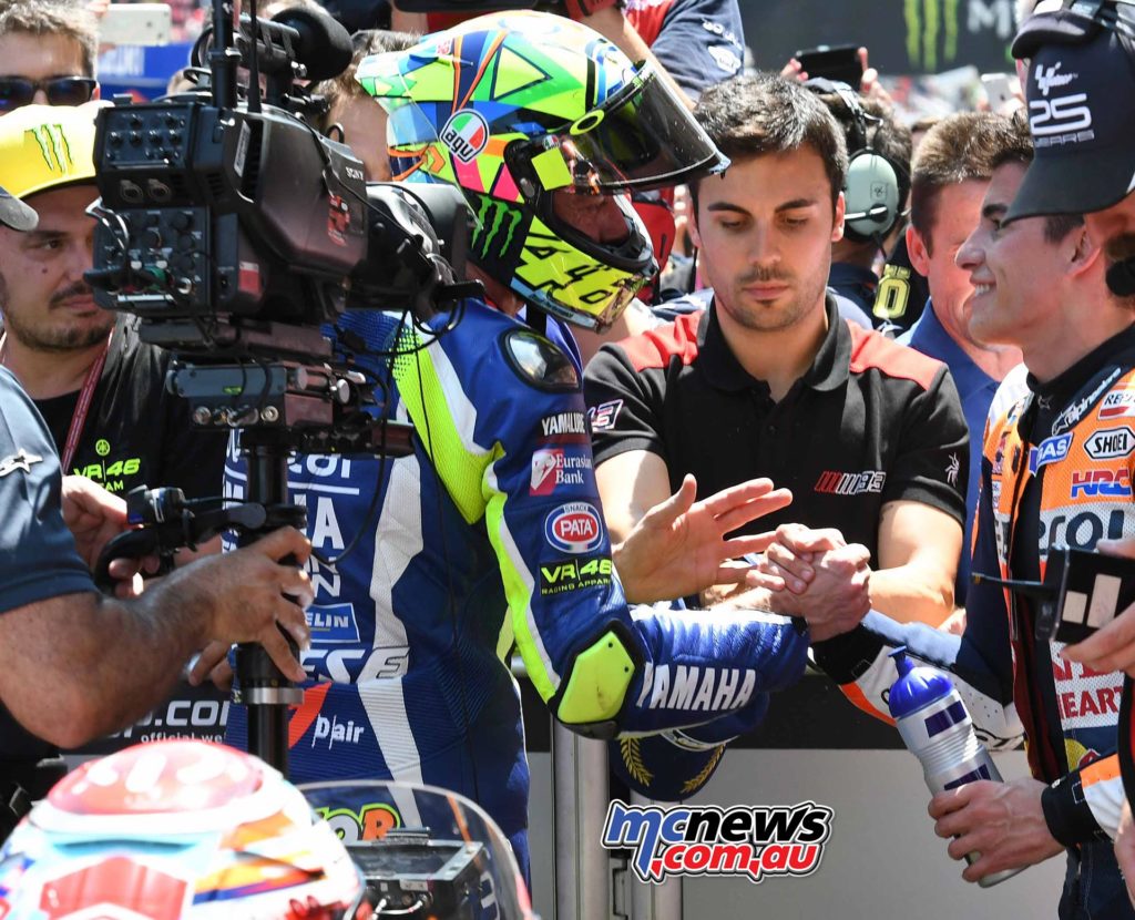 Valentino Rossi and Marc Marquez shake hands in Parc Ferme after a hectic battle at Catalunya MotoGP 2016
