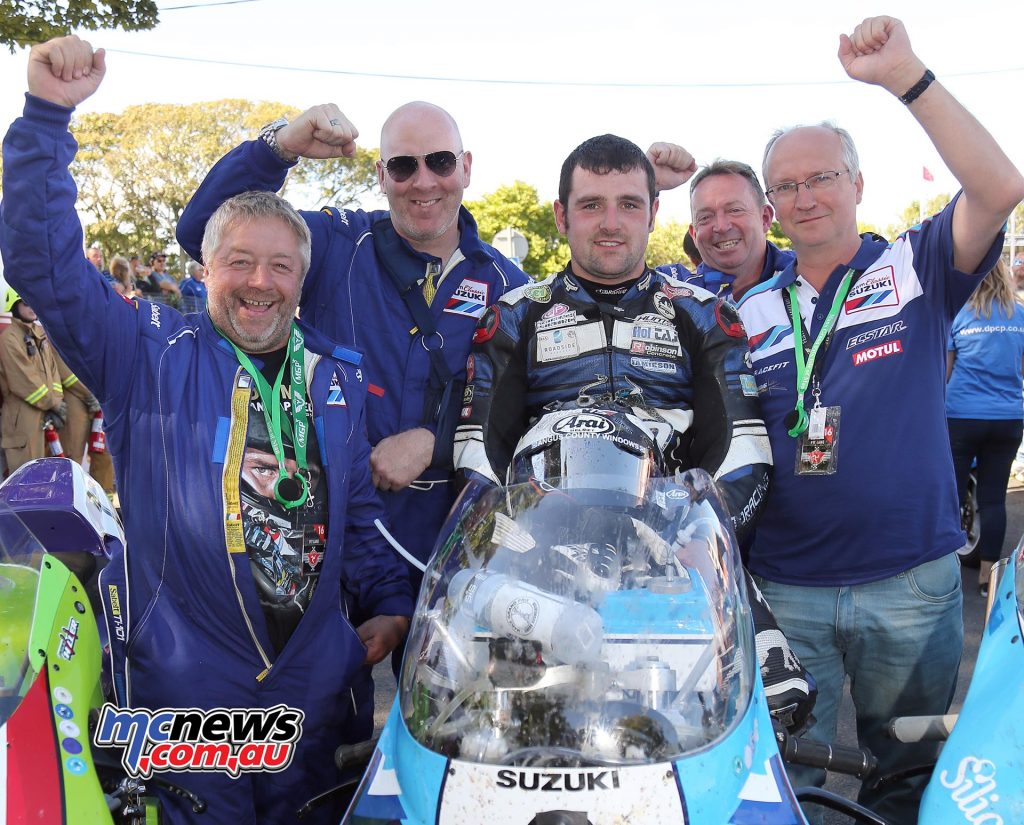 Michael Dunlop and the Team Classic Suzuki guys celebrate winning the Motorsport Merchandise Superbike Classic TT on the 1100cc Suzuki XR69 replica