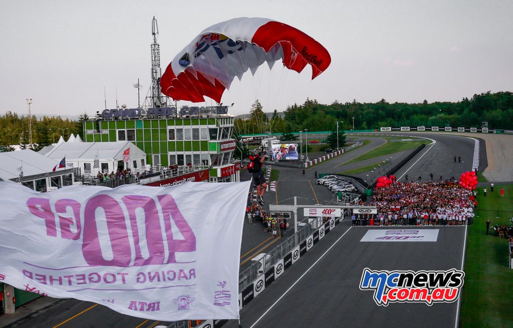 MotoGP Brno 2016 - 400 GPs of the new era! The entire MotoGP family in unison celebrates this landmark with parachutes landing in the starting grid, an orchestra, and balloons.