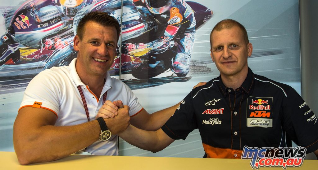 Pit Beirer and Aki Ajo sign the agreement at Misano