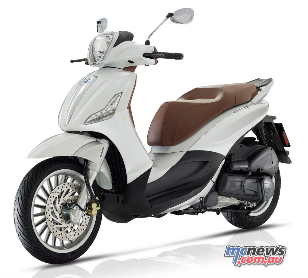 The Piaggio Beverly 300's underseat storage can fit two half face helmets.