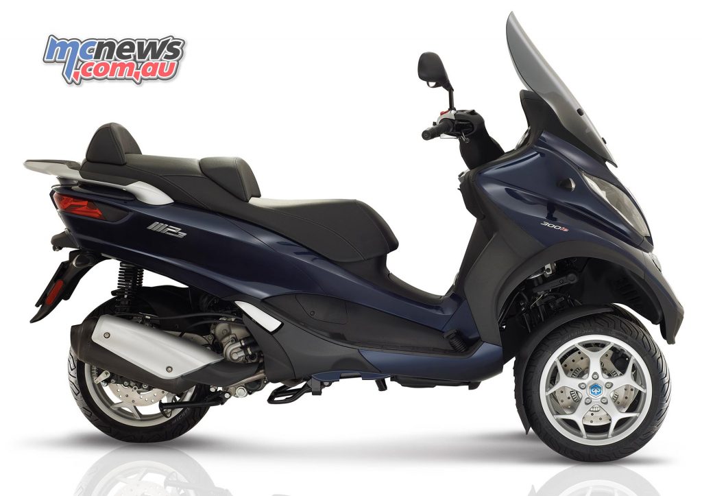 Piaggio MP3 300 Business. Underseat storage has been optimised to fit two full face helmets.