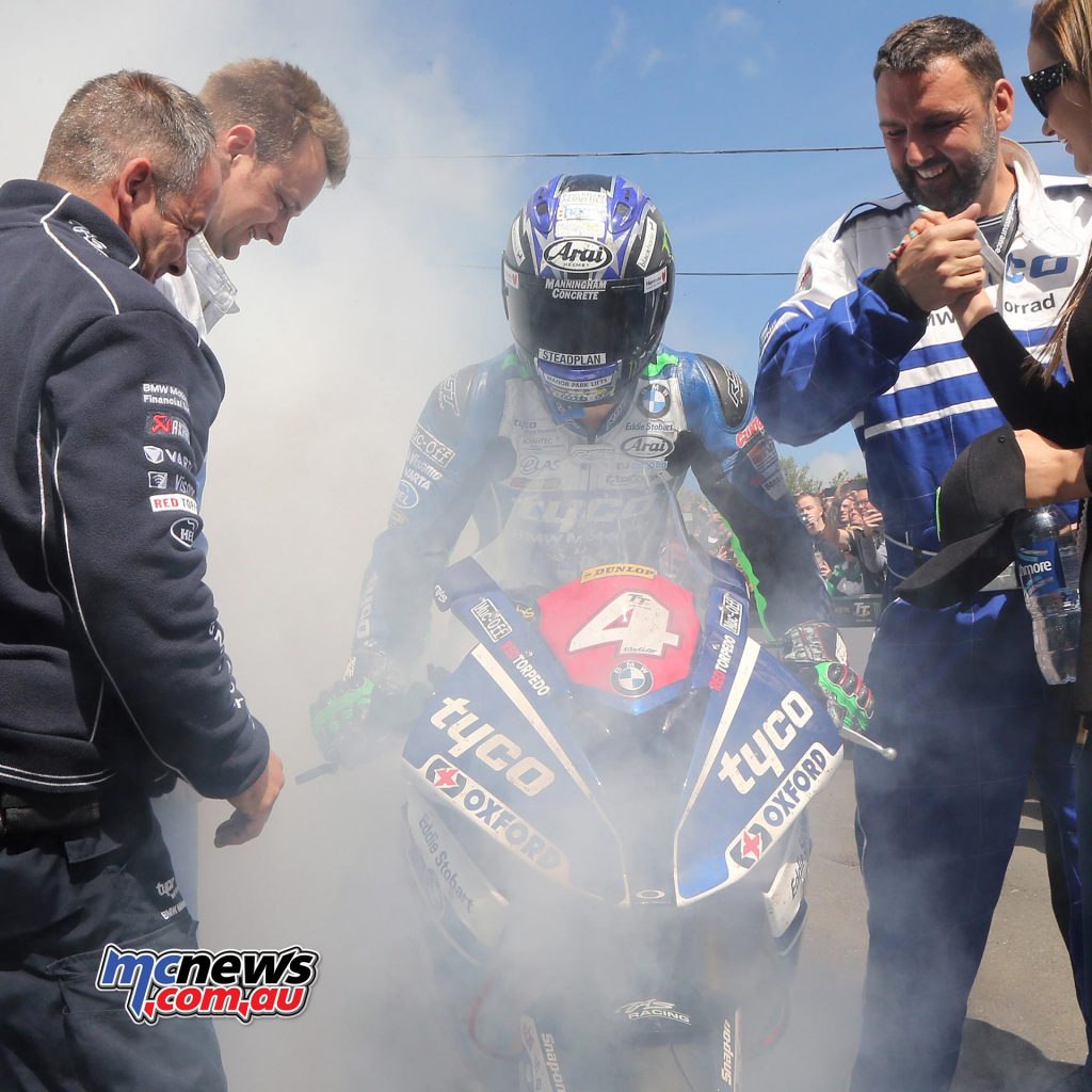 Ian Hutchinson celebrated victory with an almighty Dunlop burnout in Parc Ferme