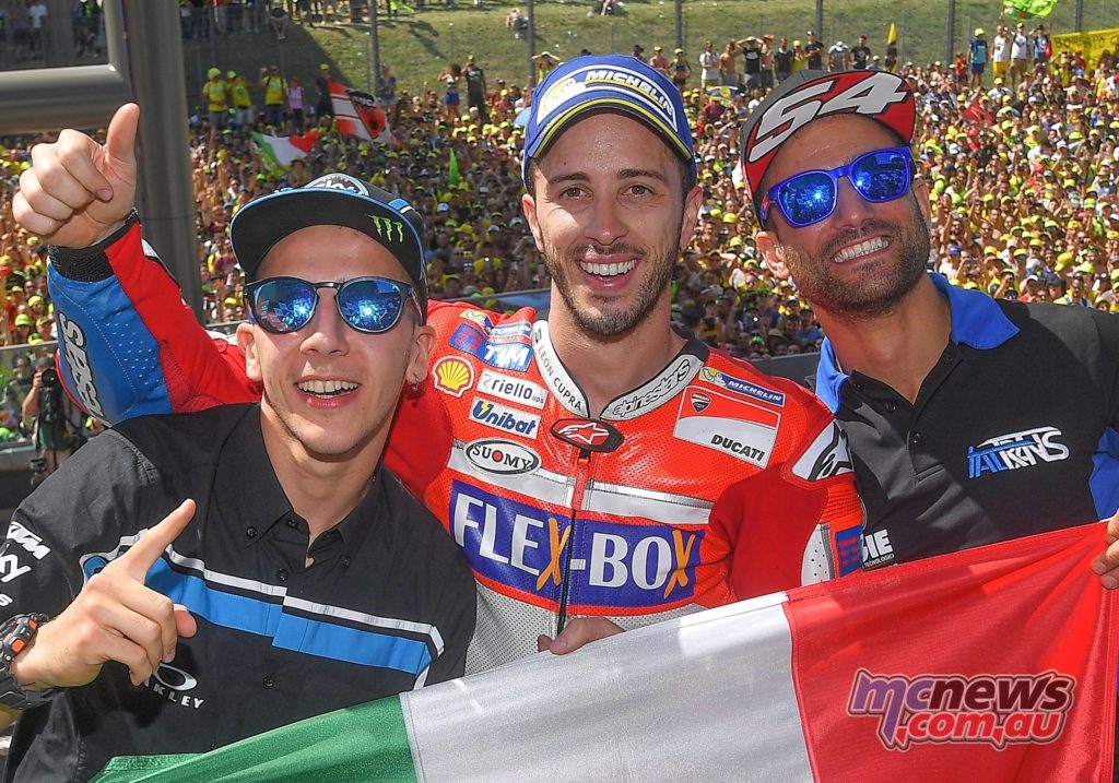 Triple Italian victory - Andrea Migno (Moto3), Andrea Dovizioso (MotoGP), and Mattia Pasini (Moto2)