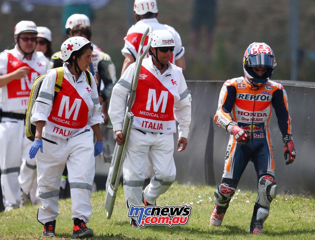 Dani Pedrosa walks away disgusted after taking out Cal Crutchlow - Image by AJRN