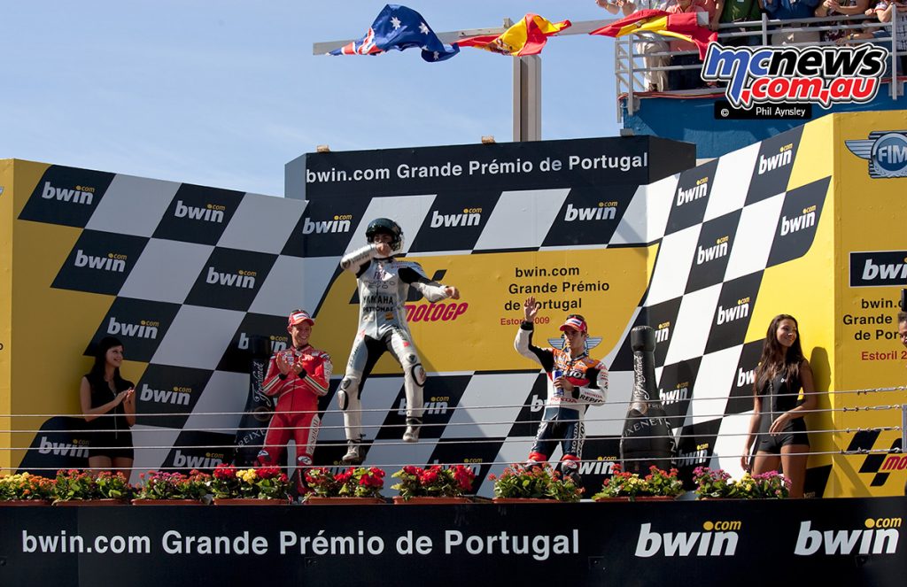 Jorge Lorenzo celebrates his win on the podium.