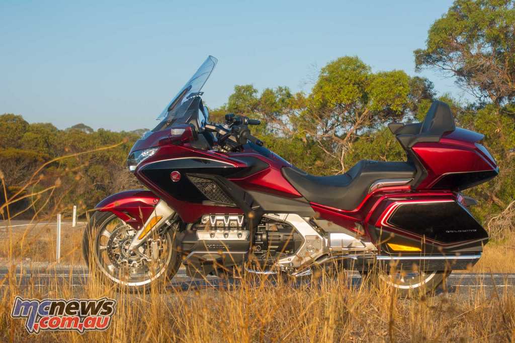 The new Gold Wing strikes a much more handsome pose than its predecessor with much smoother lines and a beautiful paint finish I reckon it is actually a very handsome machine