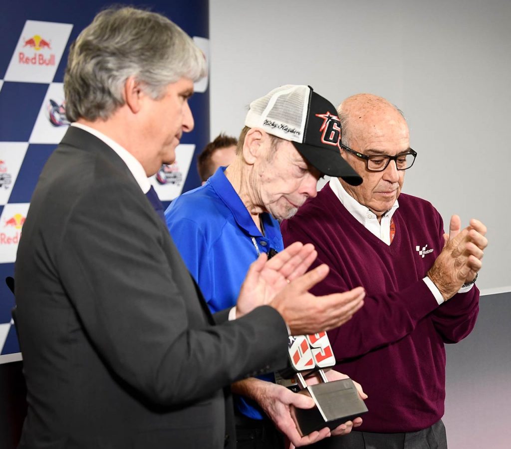 Nicky Hayden FIM President Jorge Viegas and Dorna CEO Carmelo Ezpeleta present Hayden father Earl with a commemorative number