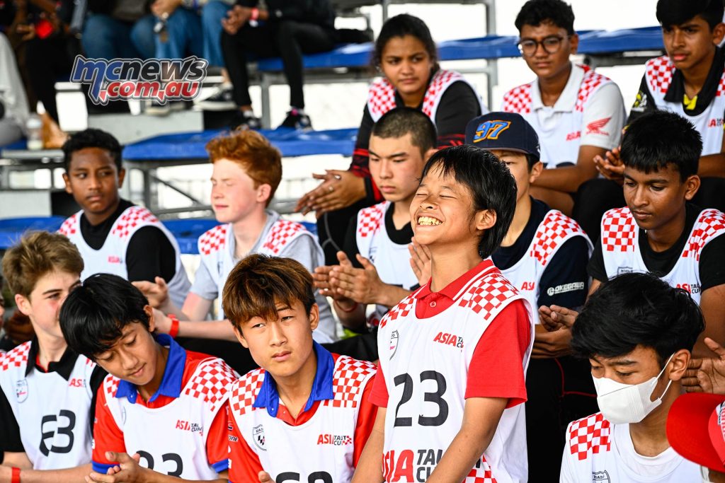 Riders wait to hear if their name is called as selected rider... The eleation written large here on 13-year-old Indonesian Jorge Raphael Gading