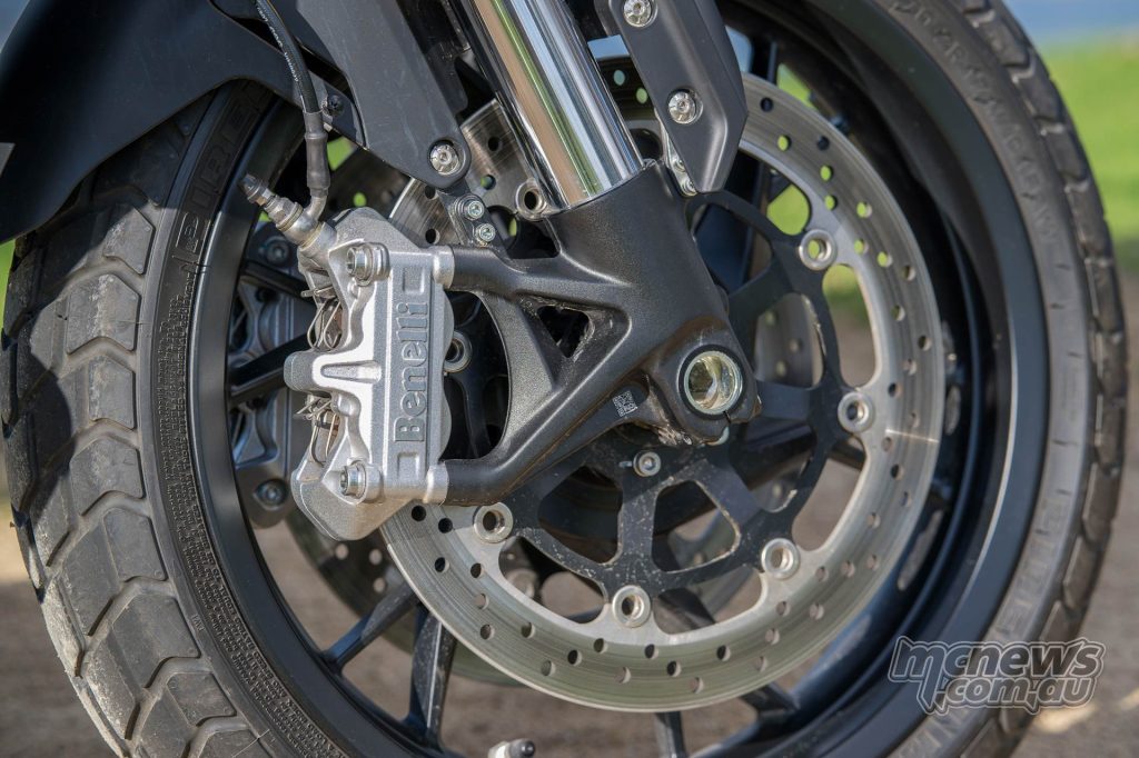 The dual 320 mm disc brake setup is let down by a wooden feel at the lever