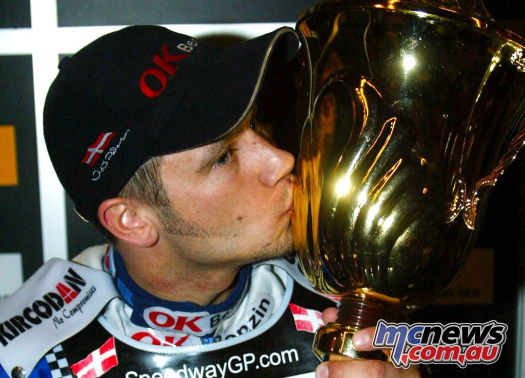 Sealed with a kiss: Nicki Pedersen claims the 2003 Speedway GP World Championship