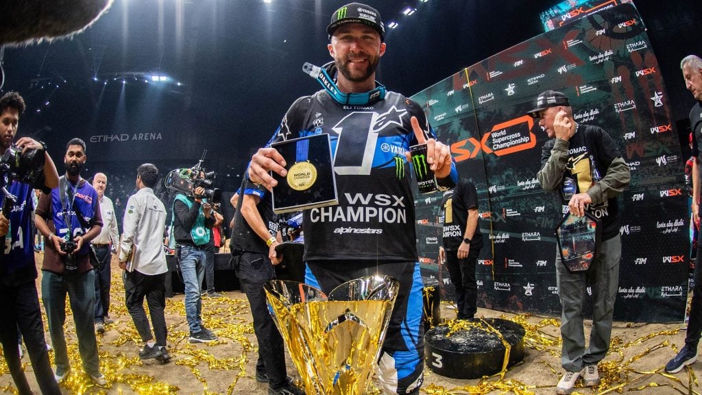 Eli Tomac celebrating the 2024 FIM World Supercross SX1 Championship with CDR Yamaha