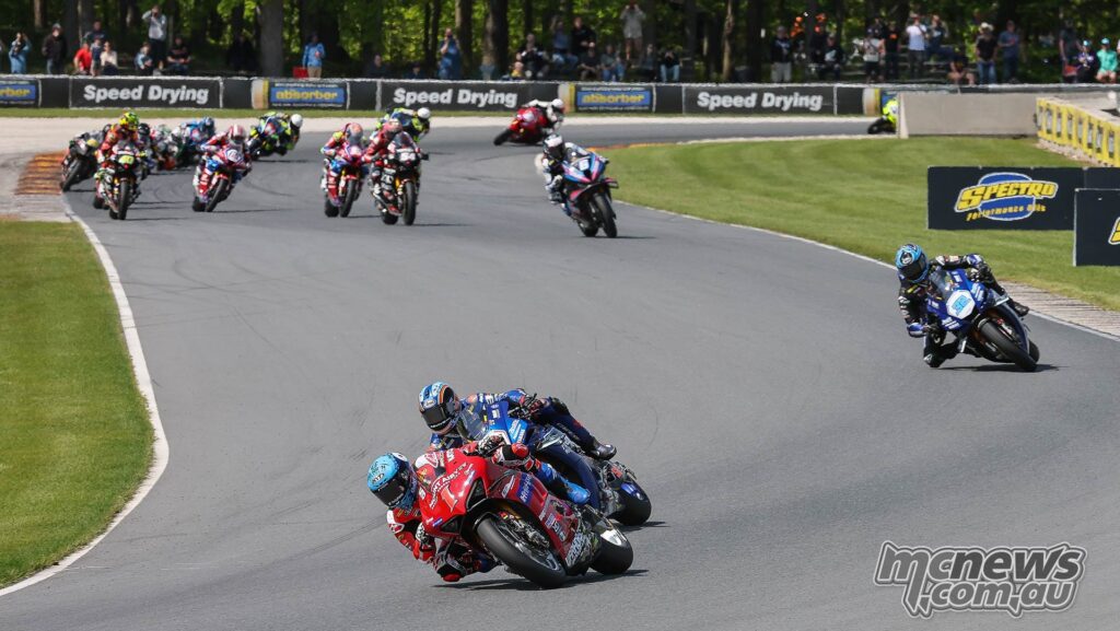 Bobby Fong looks to the inside of Herrin early in the Superbike race on Saturday at Road America. Jake Gagne (32) ended up fourth.