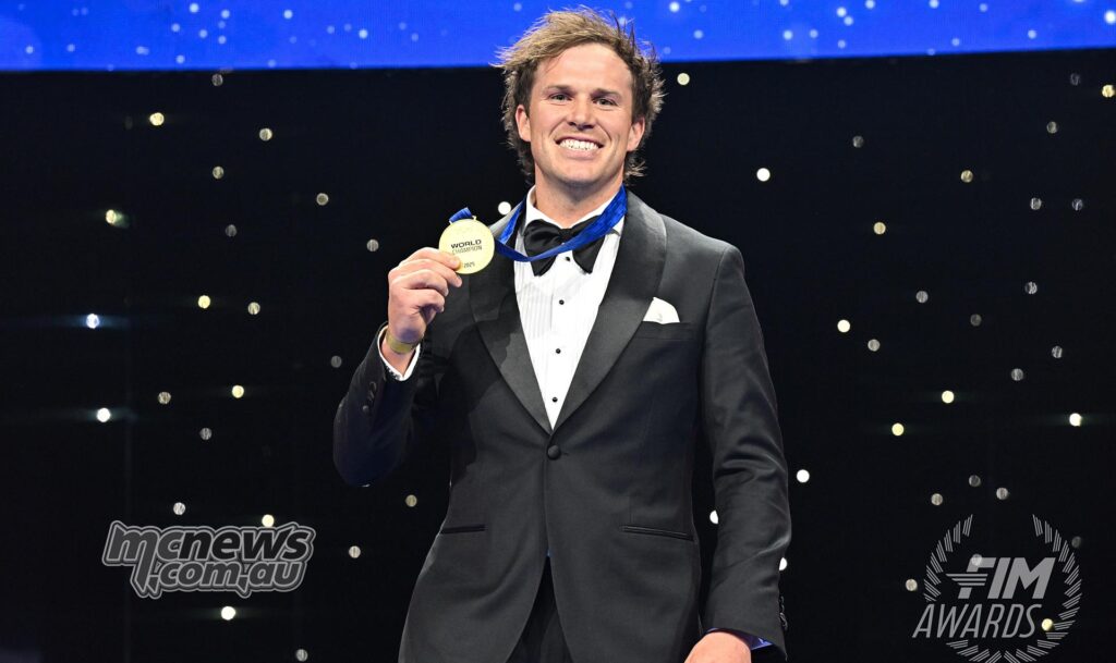 Daniel Sanders standing on stage at the FIM Awards after winning the 2025 RallyGP World Championship.