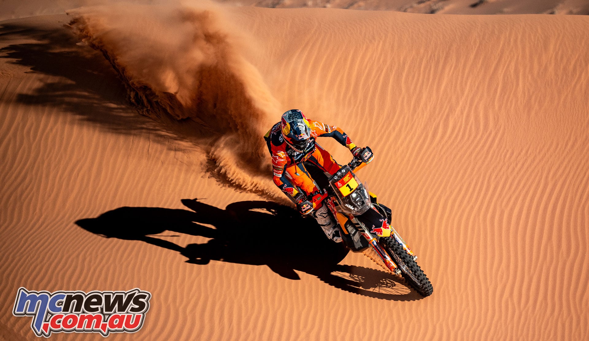 Daniel Sanders rides his Red Bull KTM down a sand dune during the 2026 Dakar Rally in Saudi Arabia.