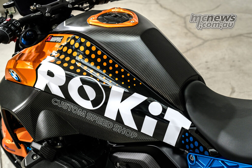 Detail view of painted panels on the BMW R 1300 R Superhooligan referencing BMW R 90 S colours