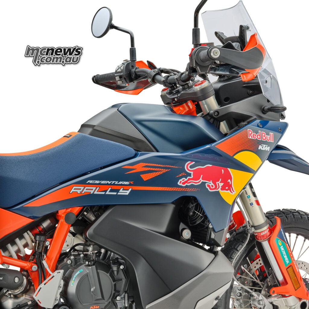 Close-up of the 2026 KTM 890 Adventure R Rally side fairing, fuel tank and front suspension with Rally graphics