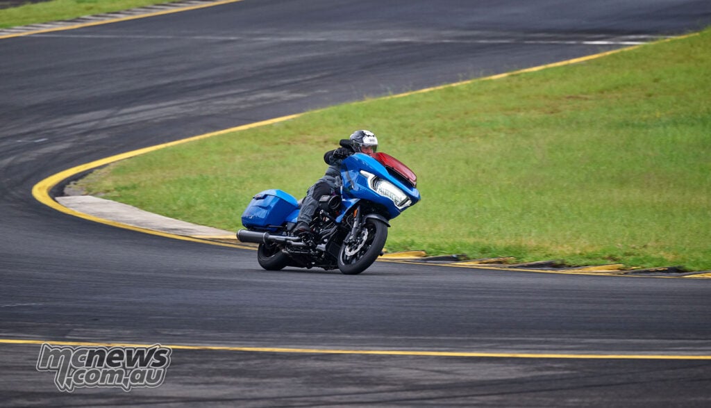 Rider cornering a blue Harley-Davidson CVO Road Glide ST at Sydney Motorsport Park while wearing SIDI Taurus GTX boots.