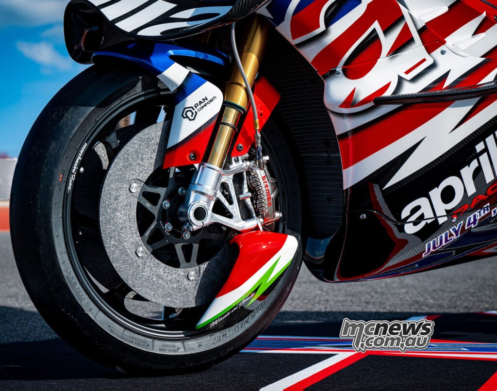 Close-up of the Aprilia X 250TH front wheel, brake disc, Brembo caliper and Öhlins fork at COTA.