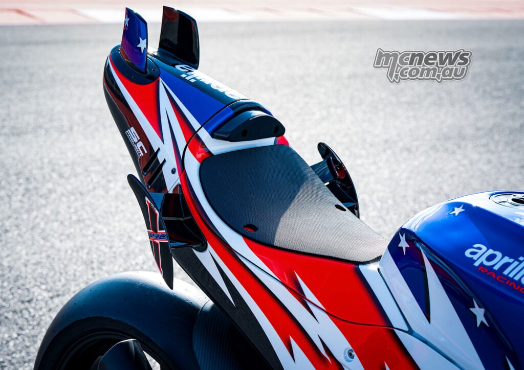 Close-up of the rear seat and tail section of the Aprilia X 250TH showing winglets and race bodywork.