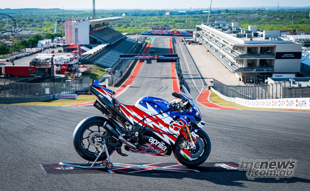 Aprilia X 250TH positioned on a hill above Circuit of the Americas main straight and pit complex.