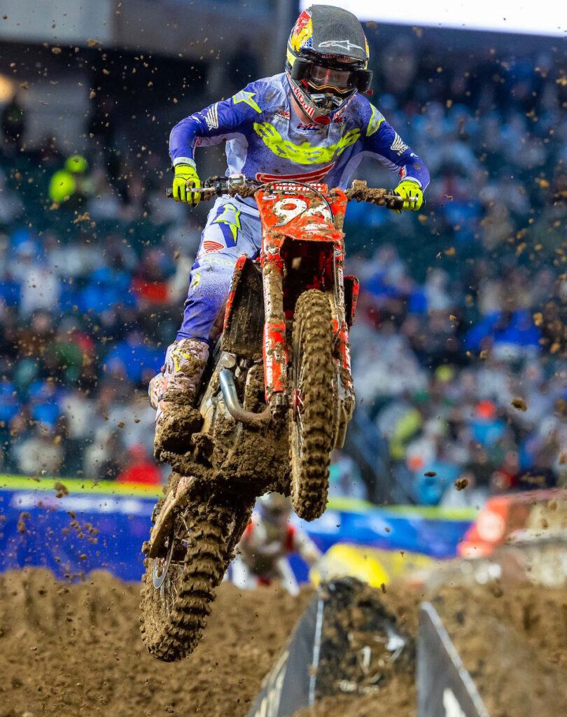 Hunter Lawrence Honda jumping a muddy Honda during Philadelphia Supercross 450 race