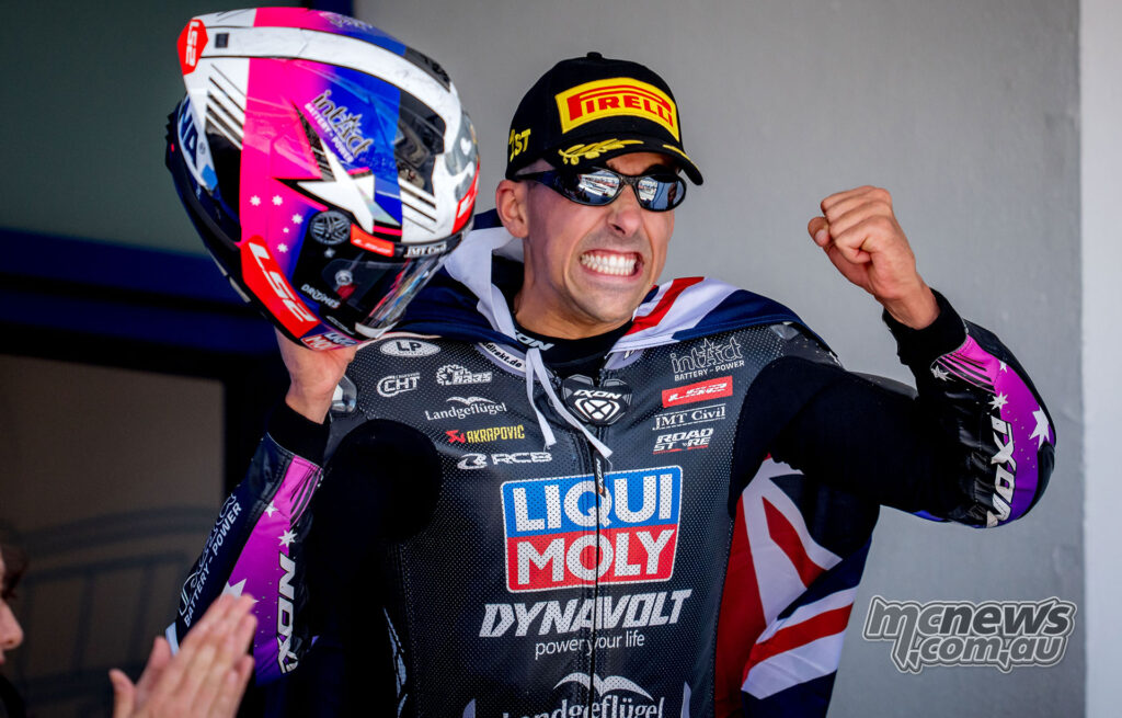 Senna Agius smiling in parc ferme after winning the Moto2 race at Jerez.