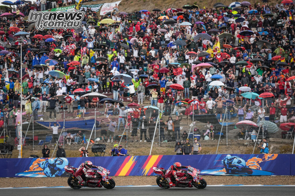Marc Márquez leads Francesco Bagnaia during the wet MotoGP Sprint at Jerez.
