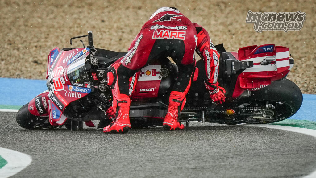 Marc Márquez tries to lift his Ducati after crashing in the MotoGP Sprint at Jerez.