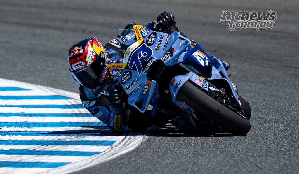 Alex Marquez leans the BK8 Gresini Ducati into a right-hand corner with his elbow near the ground at Jerez.
