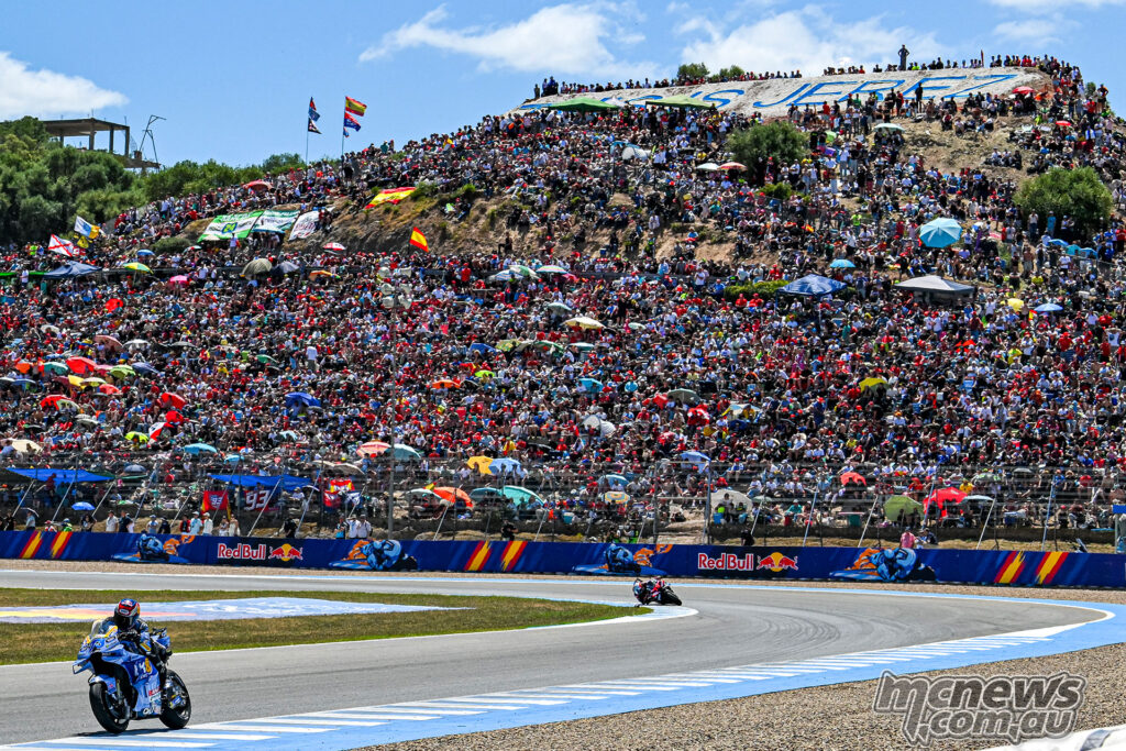 Alex Marquez leads Marco Bezzecchi with a gap opening between them during the MotoGP race at Jerez.