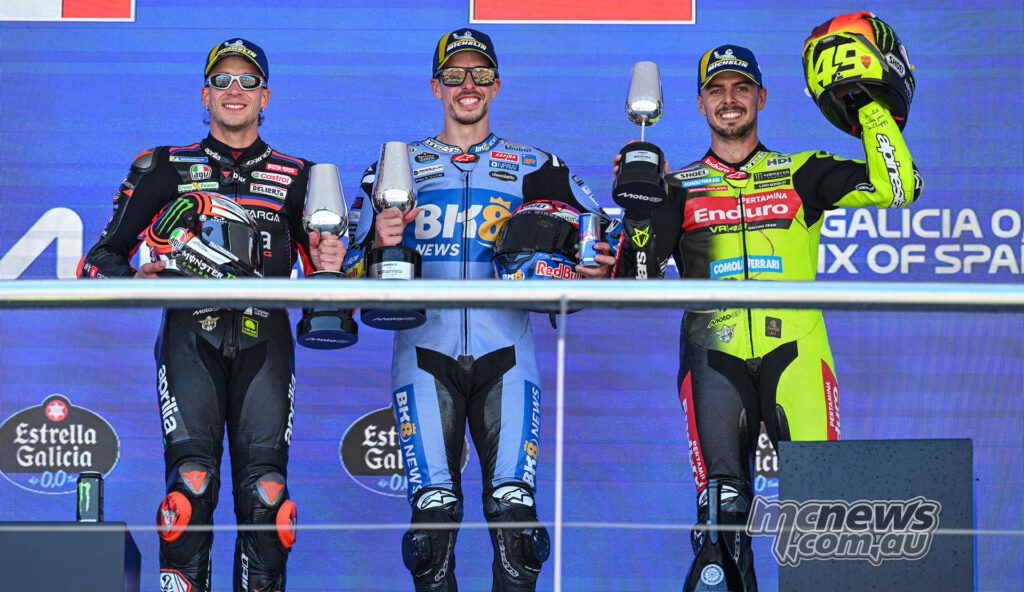 Alex Marquez stands on the top step of the Jerez MotoGP podium with Marco Bezzecchi second and Fabio Di Giannantonio third.