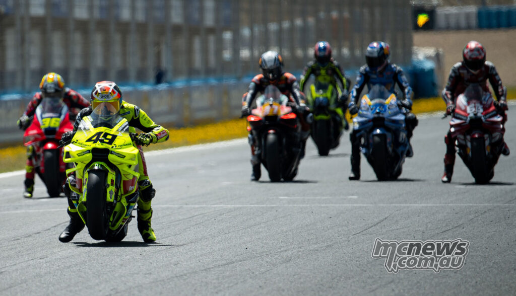 Fabio Di Giannantonio performing a practice start with other MotoGP bikes behind at Jerez.