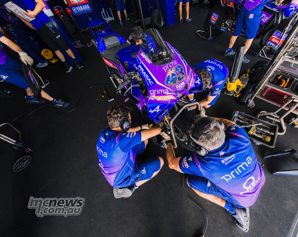 Prima Pramac Yamaha mechanics work on Jack Miller’s MotoGP bike in the Jerez pit box.