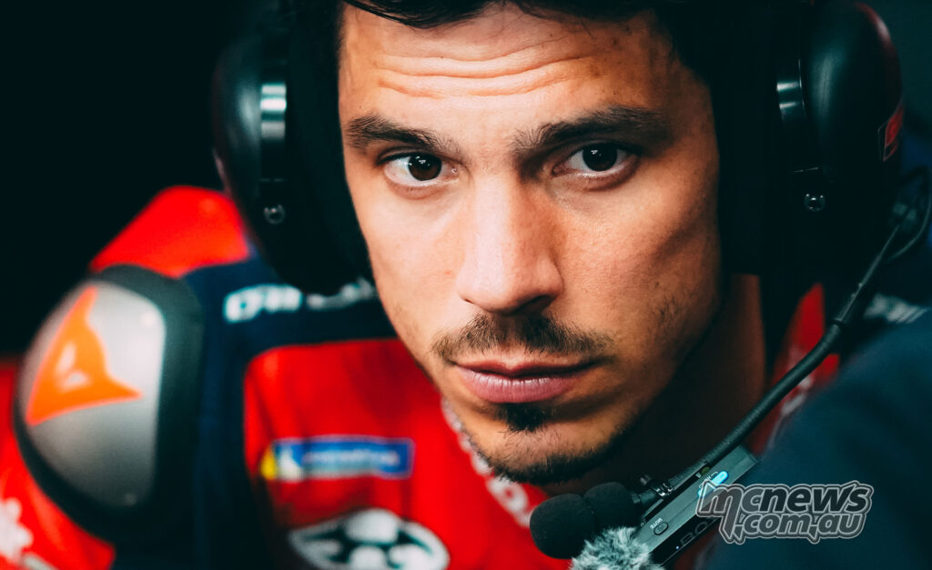 Close-up portrait of Joan Mir wearing headset gear in the Honda pit at Jerez.