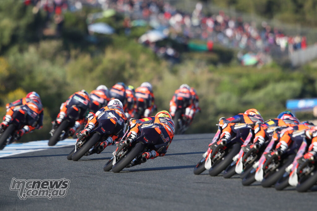 A pack of Red Bull Rookies Cup riders leans through a corner during Race 2 at Jerez.