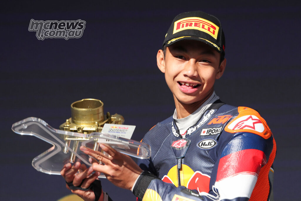 Kiandra Ramadhipa holds the Race 2 winner’s trophy on the podium at Jerez.