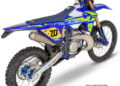 Exhaust detail on a 2026 Sherco EnduroGP Replica motorcycle showing Akrapovič branding and factory-style finish.