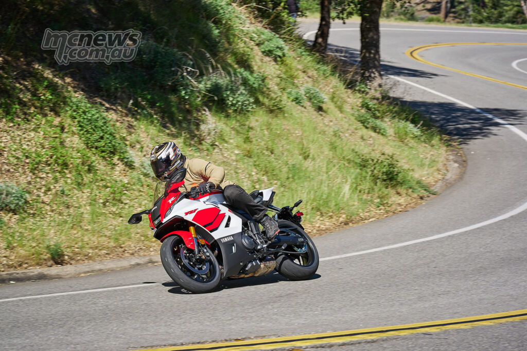 Rider seated on the 2026 Yamaha YZF-R7 showing sportbike ergonomics