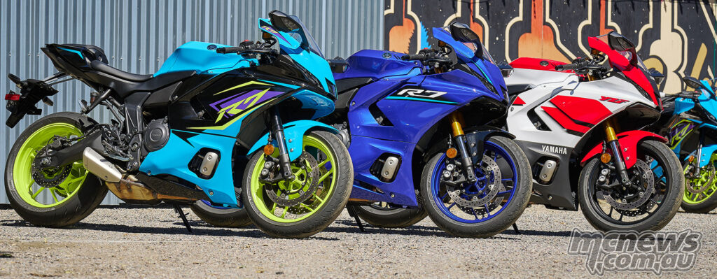 Three 2026 Yamaha YZF-R7 motorcycles parked side by side in different colours.